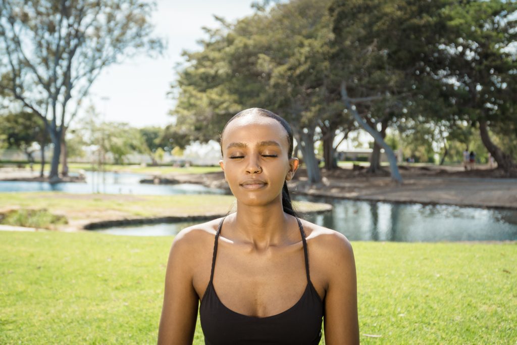 woman meditating in TeWinkle Park